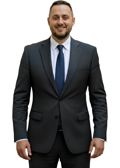 Nihad Suljic, CEO and Founder of FM Solutions, in a dark suit and navy tie